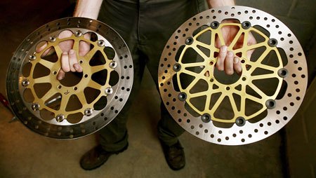 Aftermarket brake rotors are the only place a Supersport racer can save on unsprung weight. The OEM Brembo units (left) were replaced with Brembo's HP rotor kit (right). The HP rotors are lighter and thicker and are a fully-floating design. (Photo by Holly Marcus)