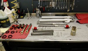 The Ducati's Showa front lies disassembled on a Race Tech workbench awaiting rebuild. Race Tech also sells its components to intrepid garage mechanics who want to rebuild their suspension on their own. (Photo courtesy of Race Tech)