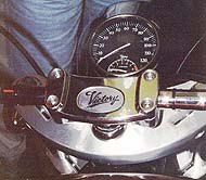 Note the Victory's distinctive handlebar clamp and headlamp-mounted speedo 