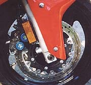 The stock Nissin calipers, pads and rotors on the YZF are the best OEM four-piston brakes we've ever tested.