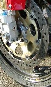 Pirelli Supercorsa rubber, BlackStone Tek carbon fiber wheels, Ohlins fork, small penis--it all goes together.