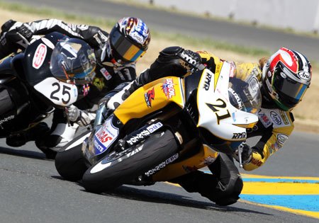 Joey Pascarella (25) crashed on lap 10 of Race One, stopping the race and giving Elena Myers (21) a historic first win for a woman in AMA Pro Road Racing.
